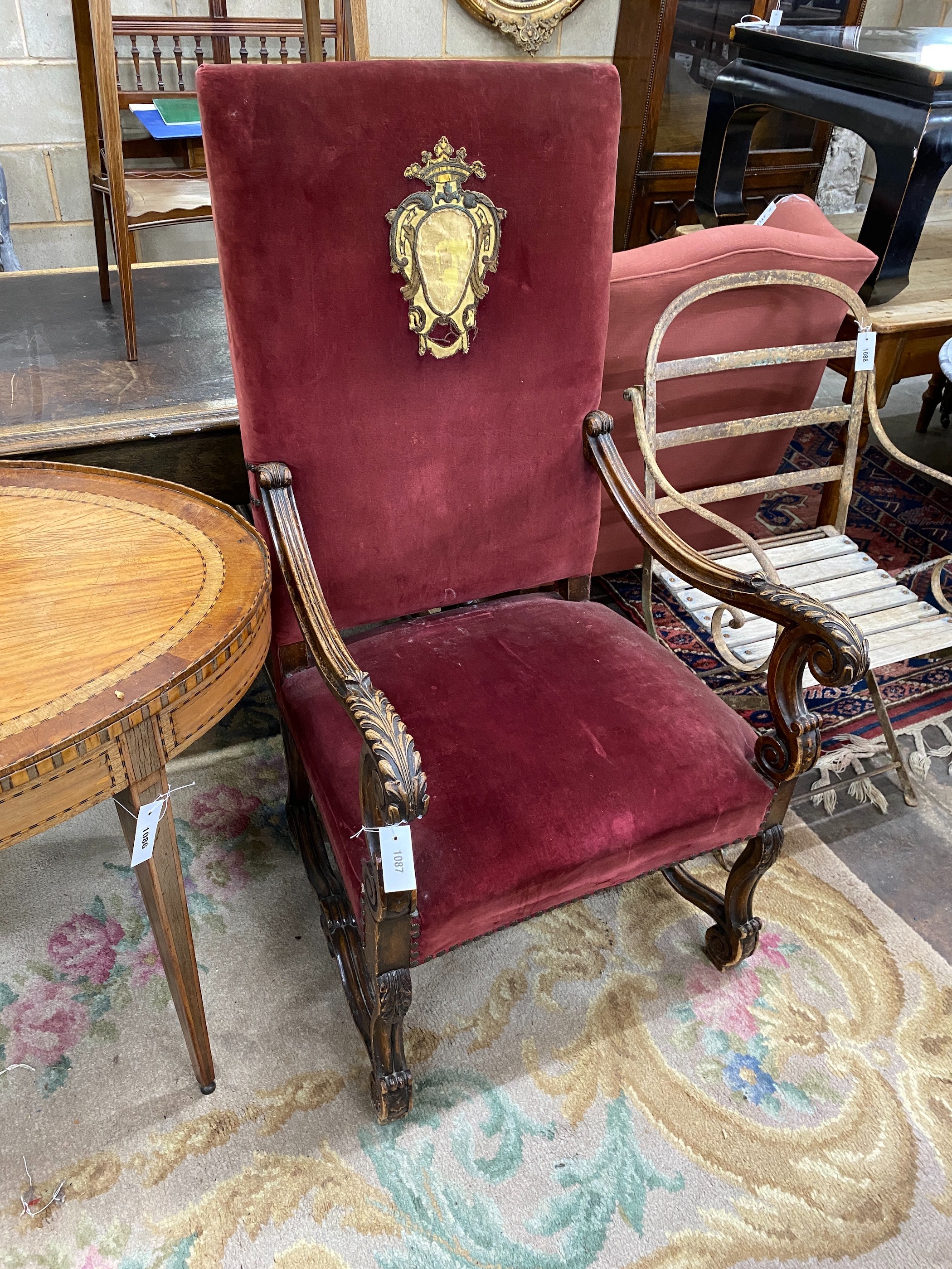 An 18th century style French carved walnut upholstered elbow chair, width 64cm, depth 60cm, height 124cm